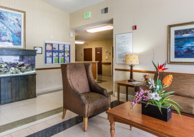 Reception area at Bay Crest with comfortable chairs and a fish aquarium.