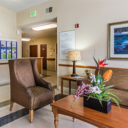 The front lobby with soft seating at the reception area of Bay Crest Care Center
